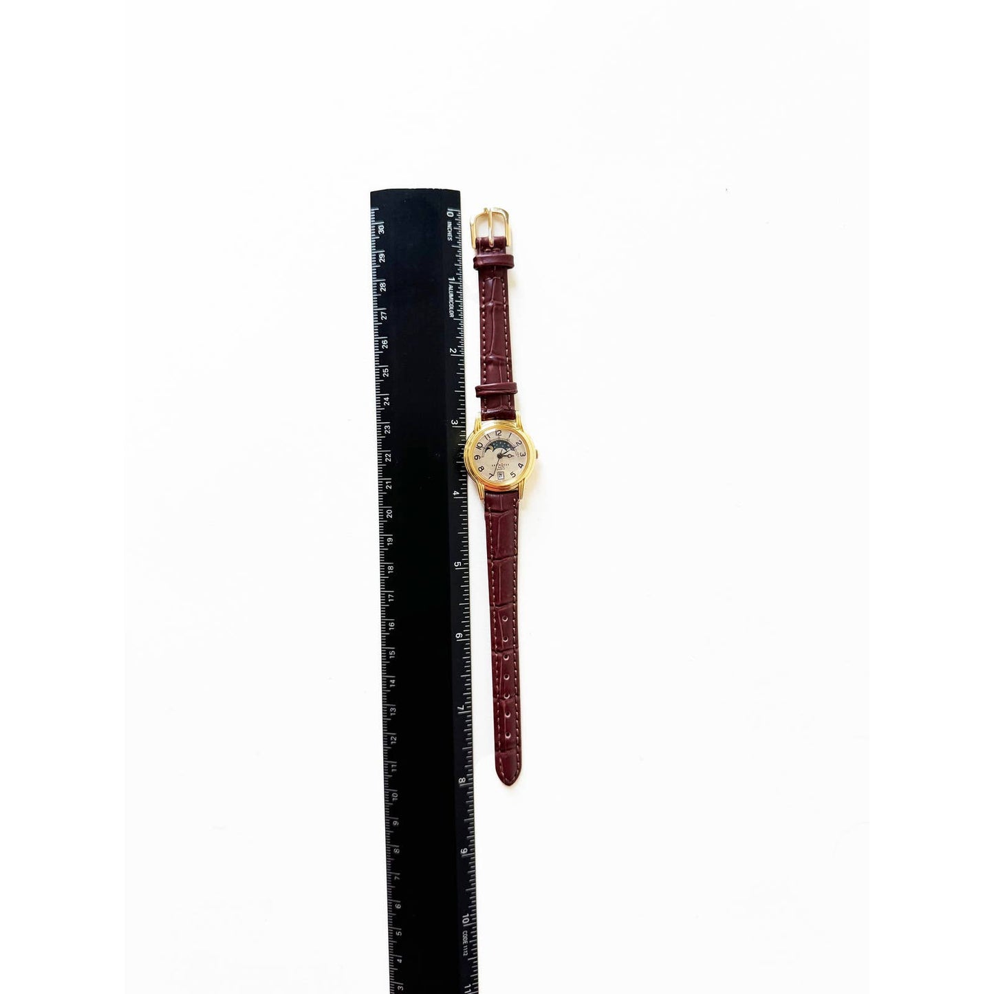 Vintage Leather Watch with Brown Band and Gold Details and Sky no