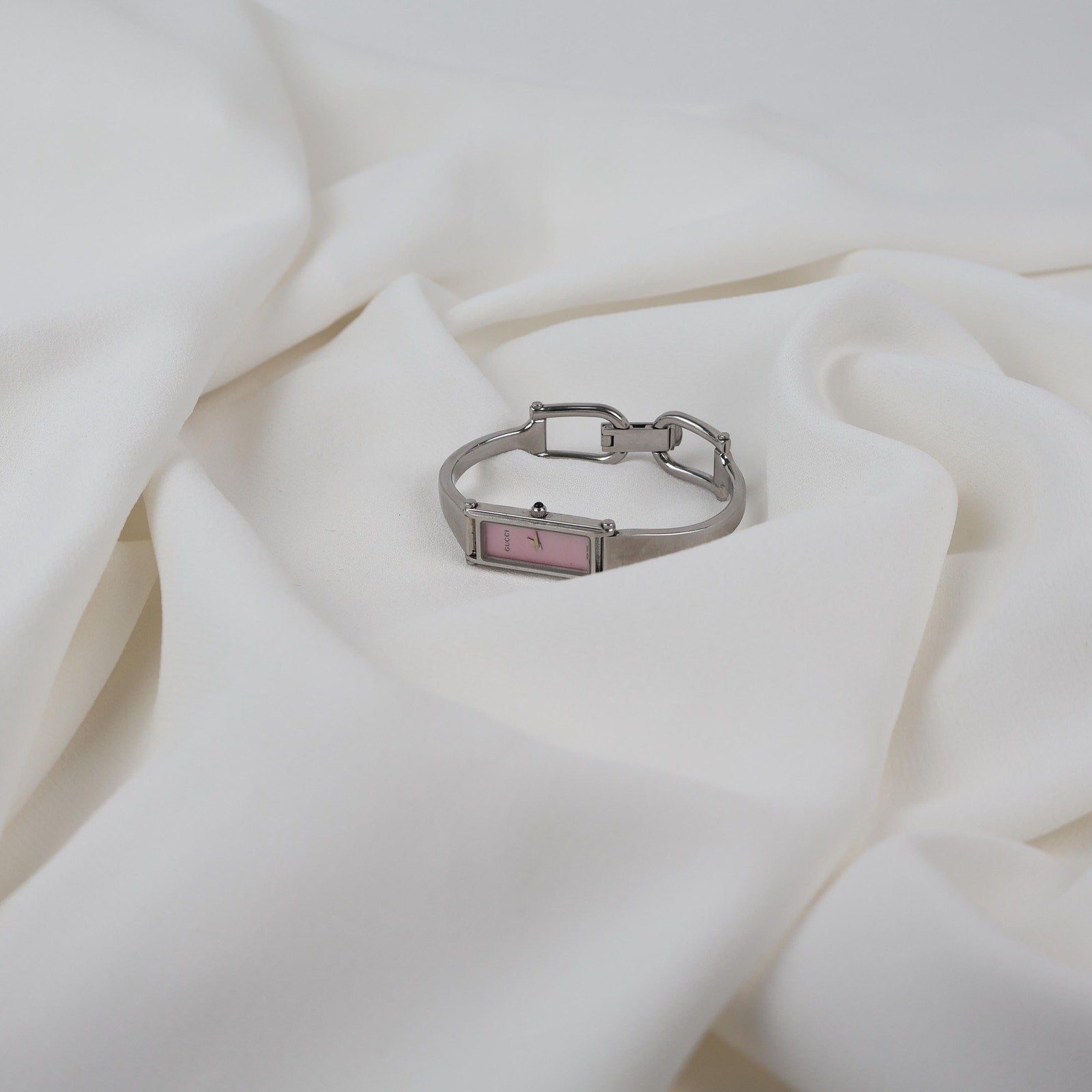 Vintage Silver Gucci Horse-Bit Watch with a Pink Opalesent Face