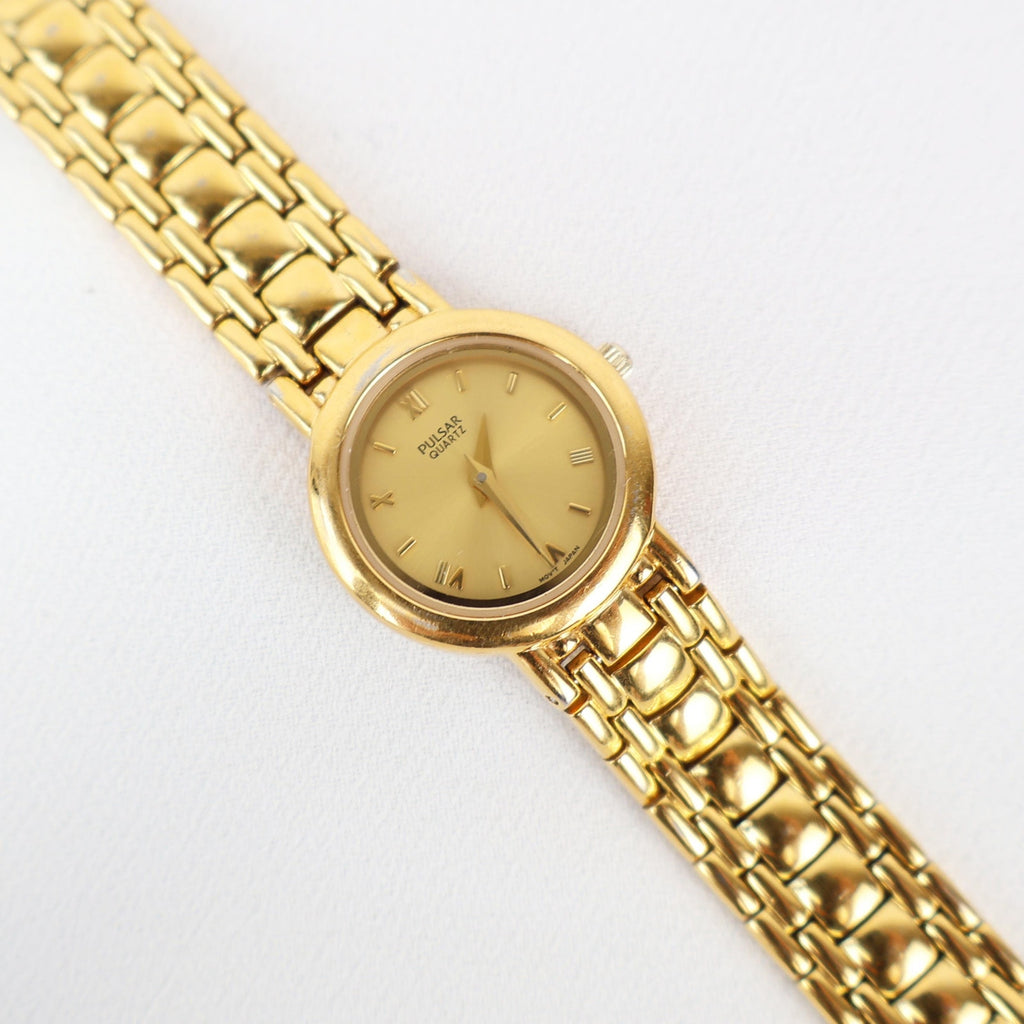 Vintage Gold Tone Pulsar Watch with a Circle Face