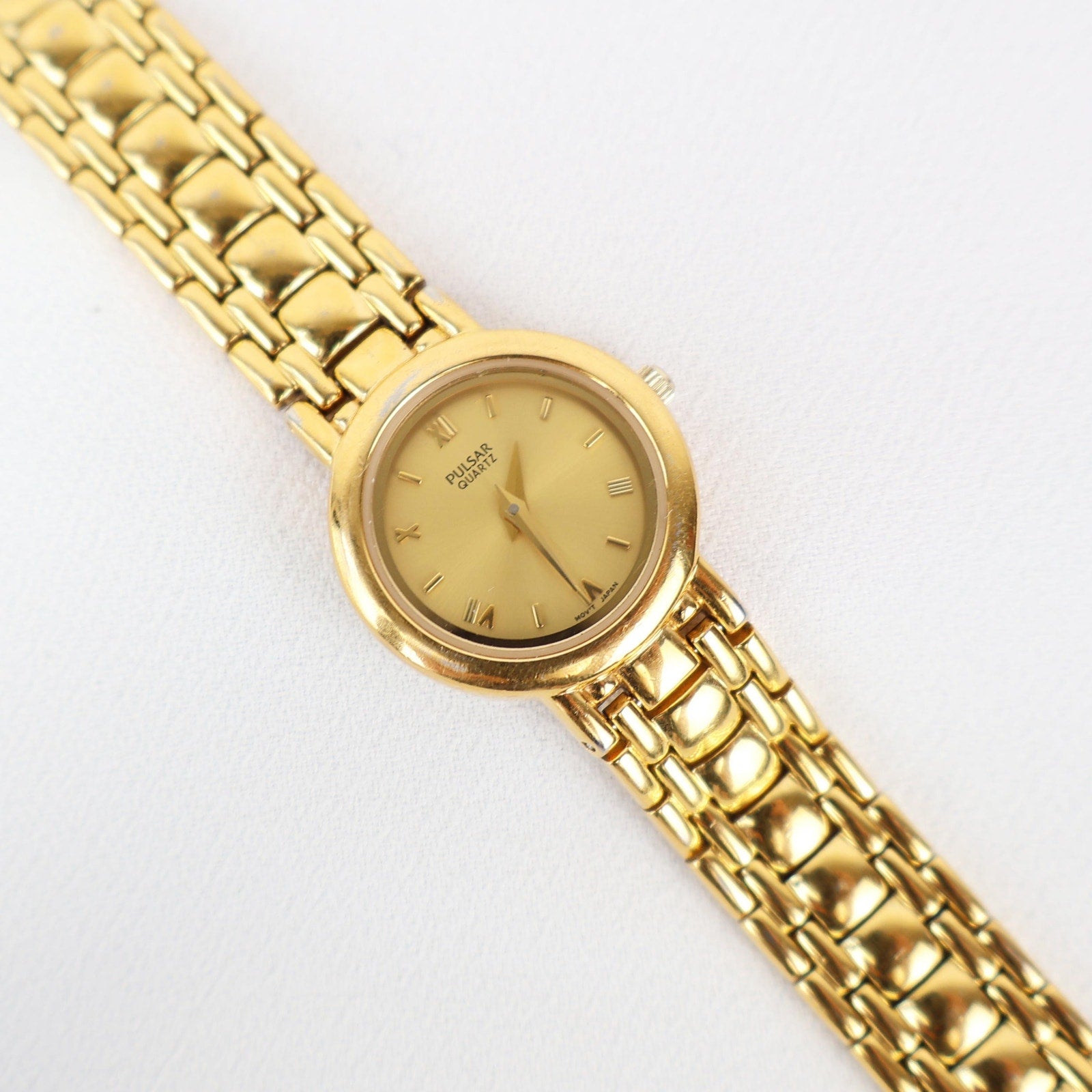 Vintage Gold Tone Pulsar Watch with a Circle Face