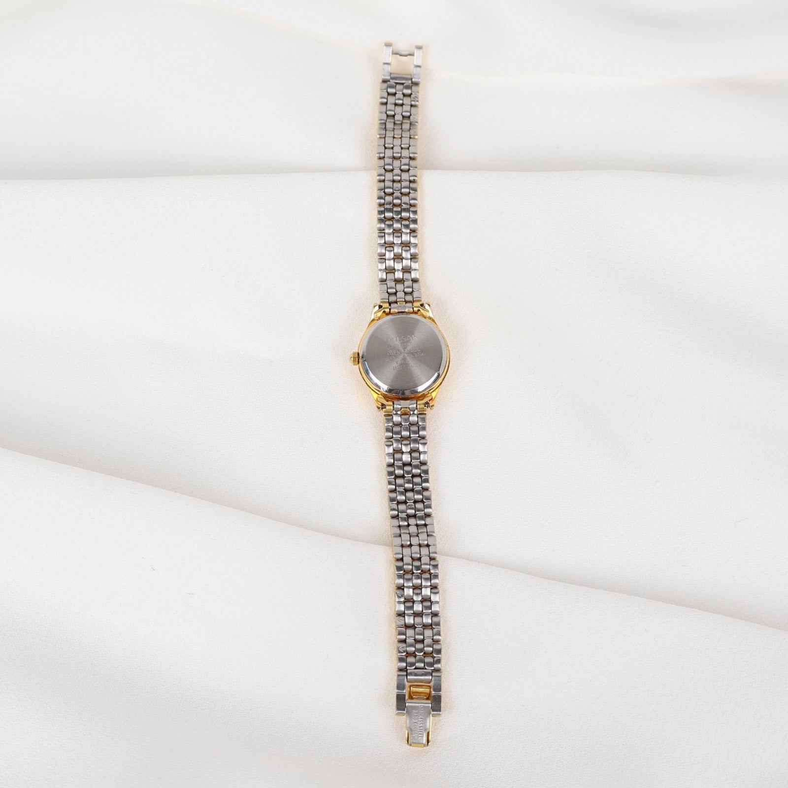 Vintage Gold Tone Pulsar Watch with a Circle Face