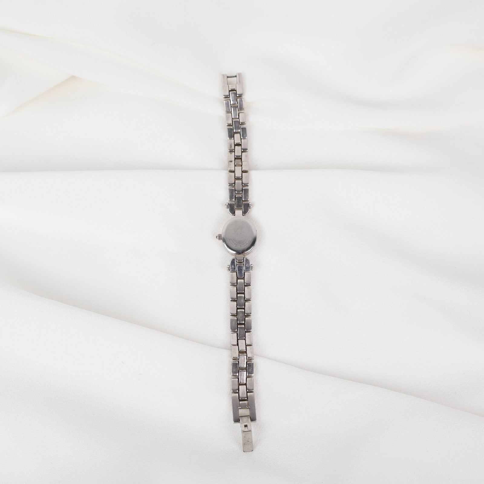 Vintage Silver Anne Klein Watch with an Oval Shaped Face