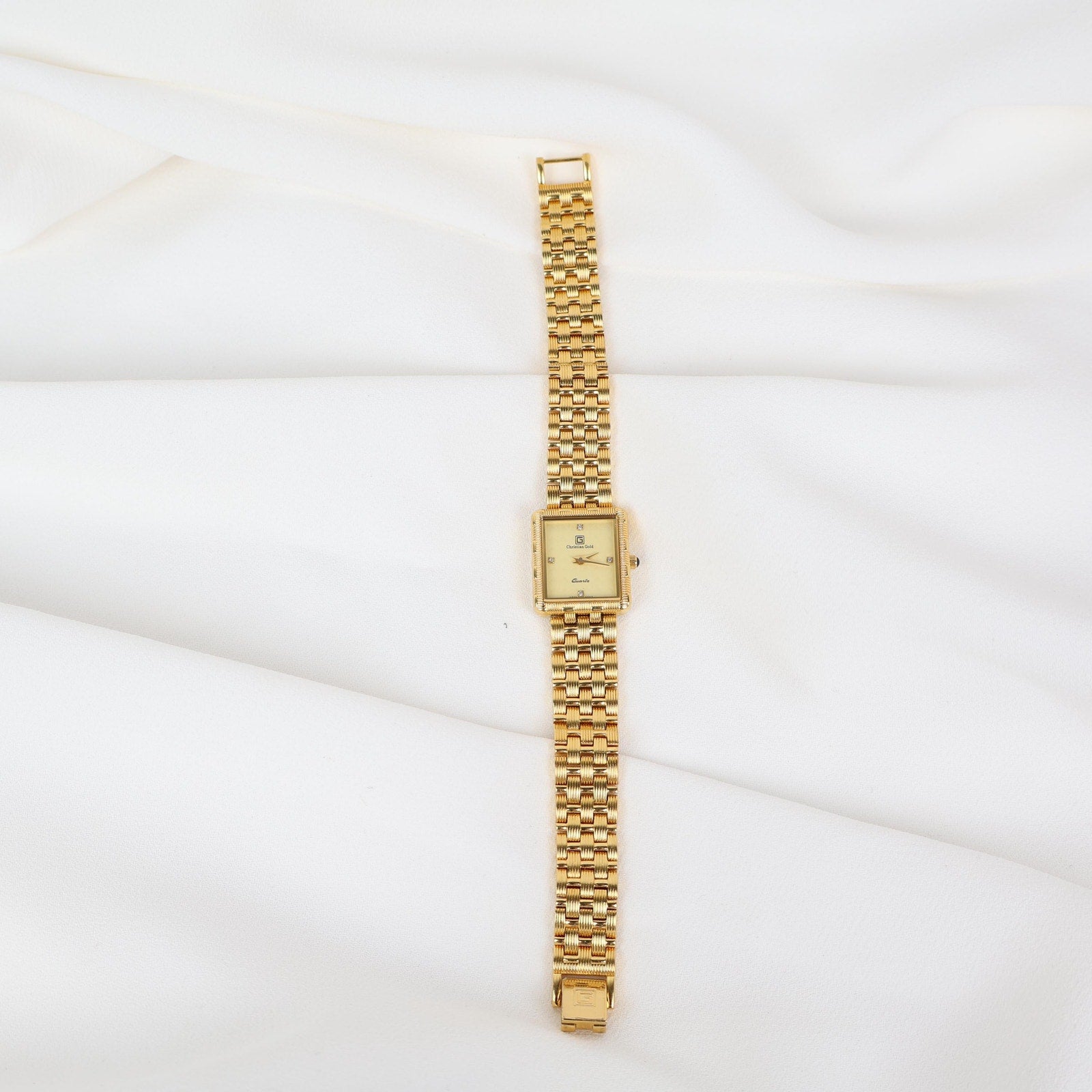 Vintage Gold Christian Gold Watch with a Rectangle Face