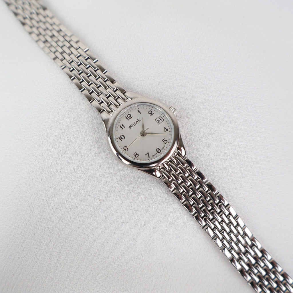 Vintage Silver Pulsar Watch with a Round Face