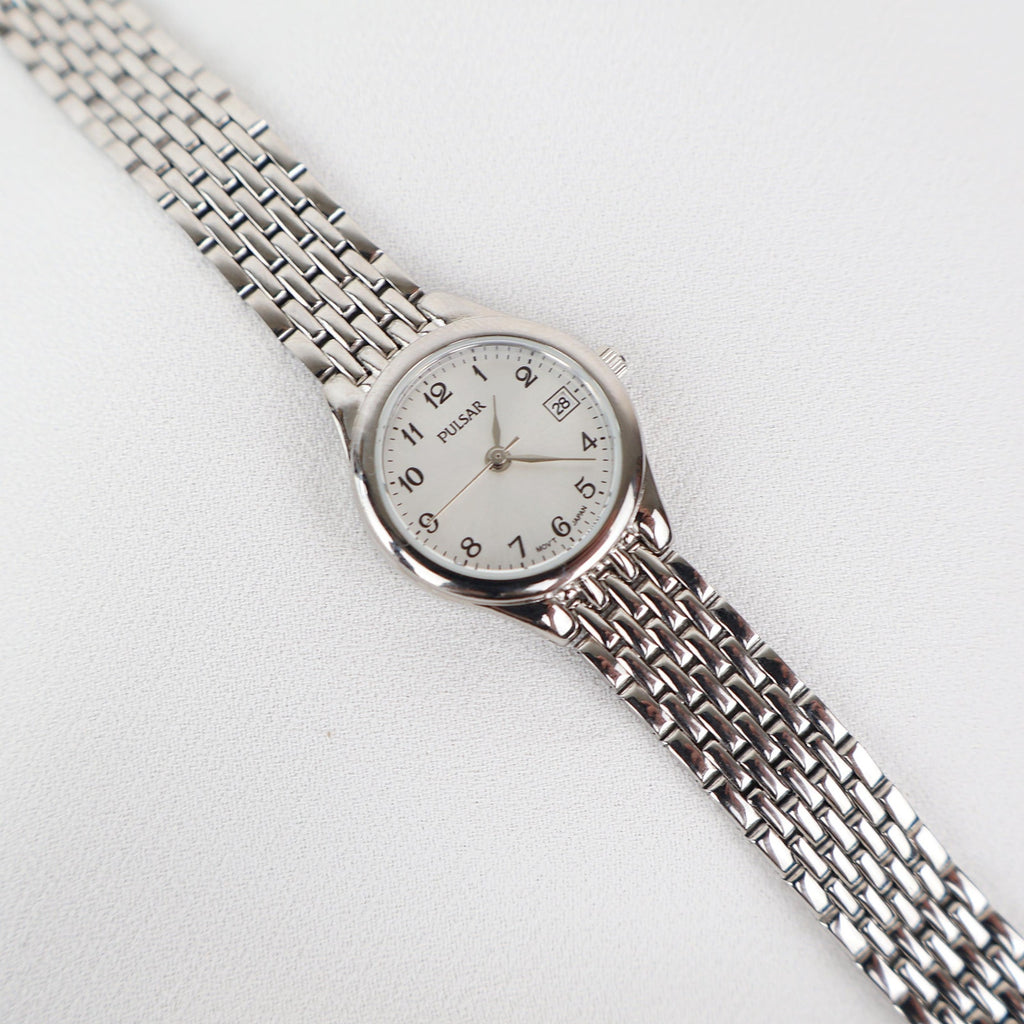 Vintage Silver Pulsar Watch with a Round Face