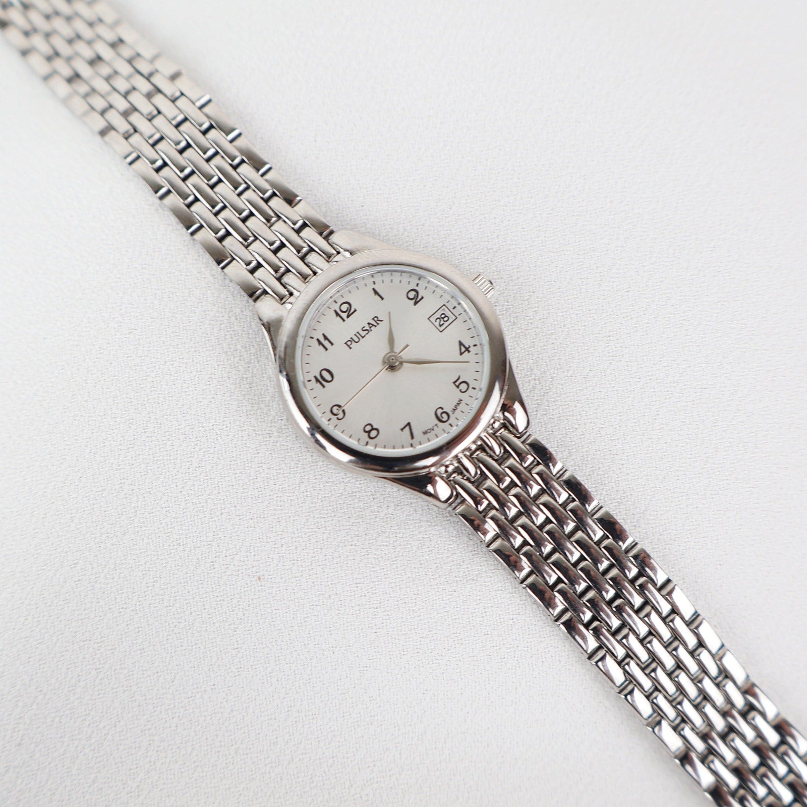 Vintage Silver Pulsar Watch with a Round Face
