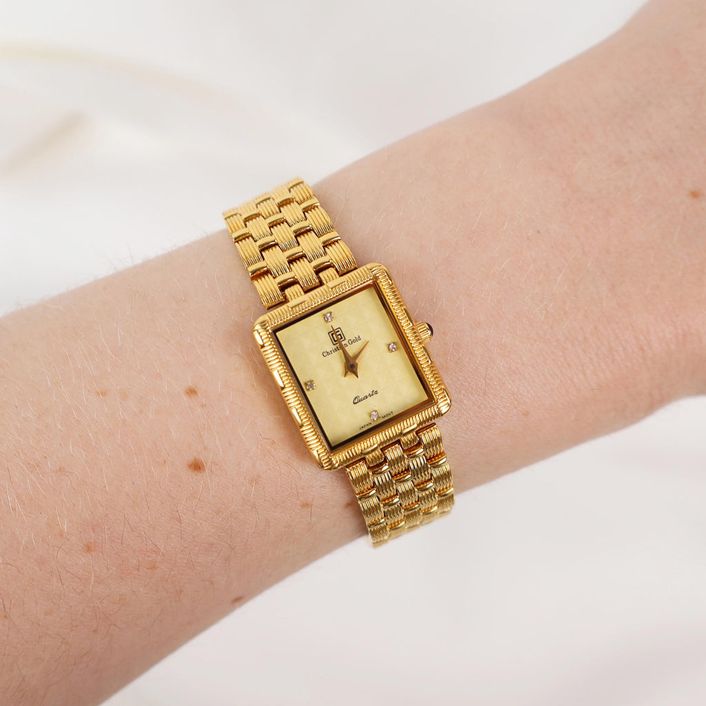 Vintage Gold Christian Gold Watch with a Rectangle Face