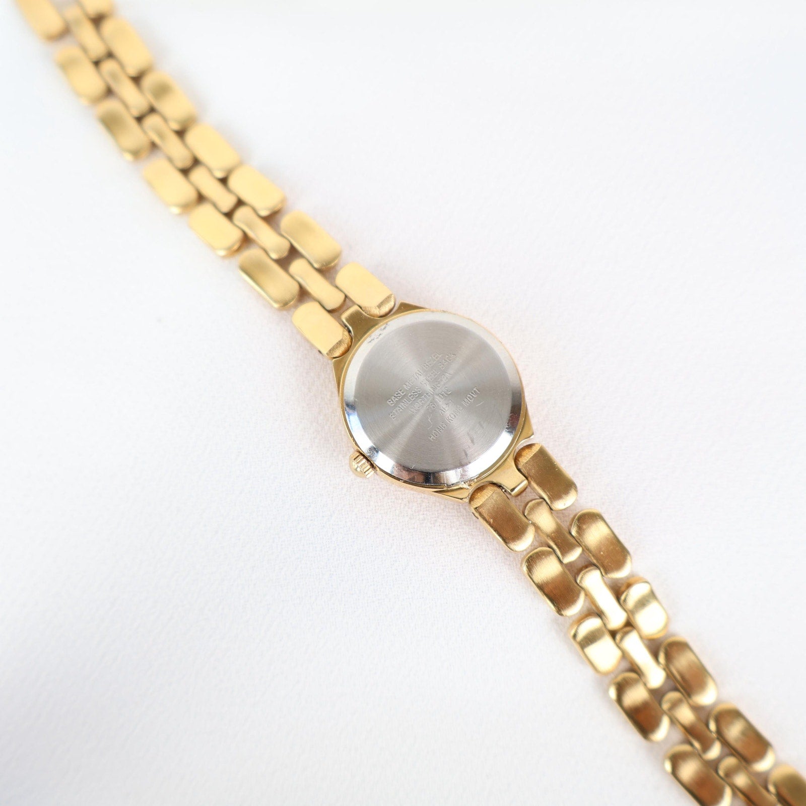 Vintage Black and Gold Worthington Watch with Round Face