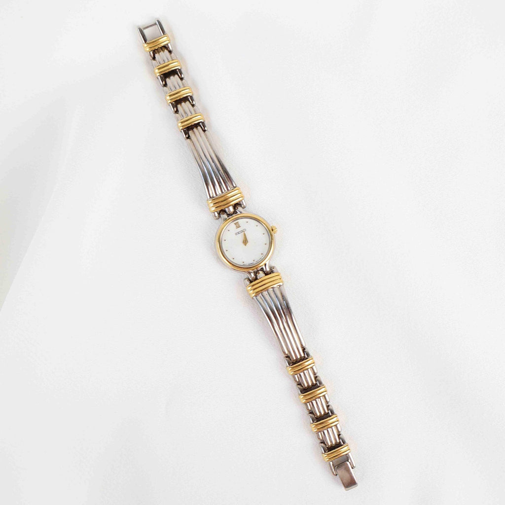 Vintage Two Tone Seiko with a White Round Face - (Working Battery)