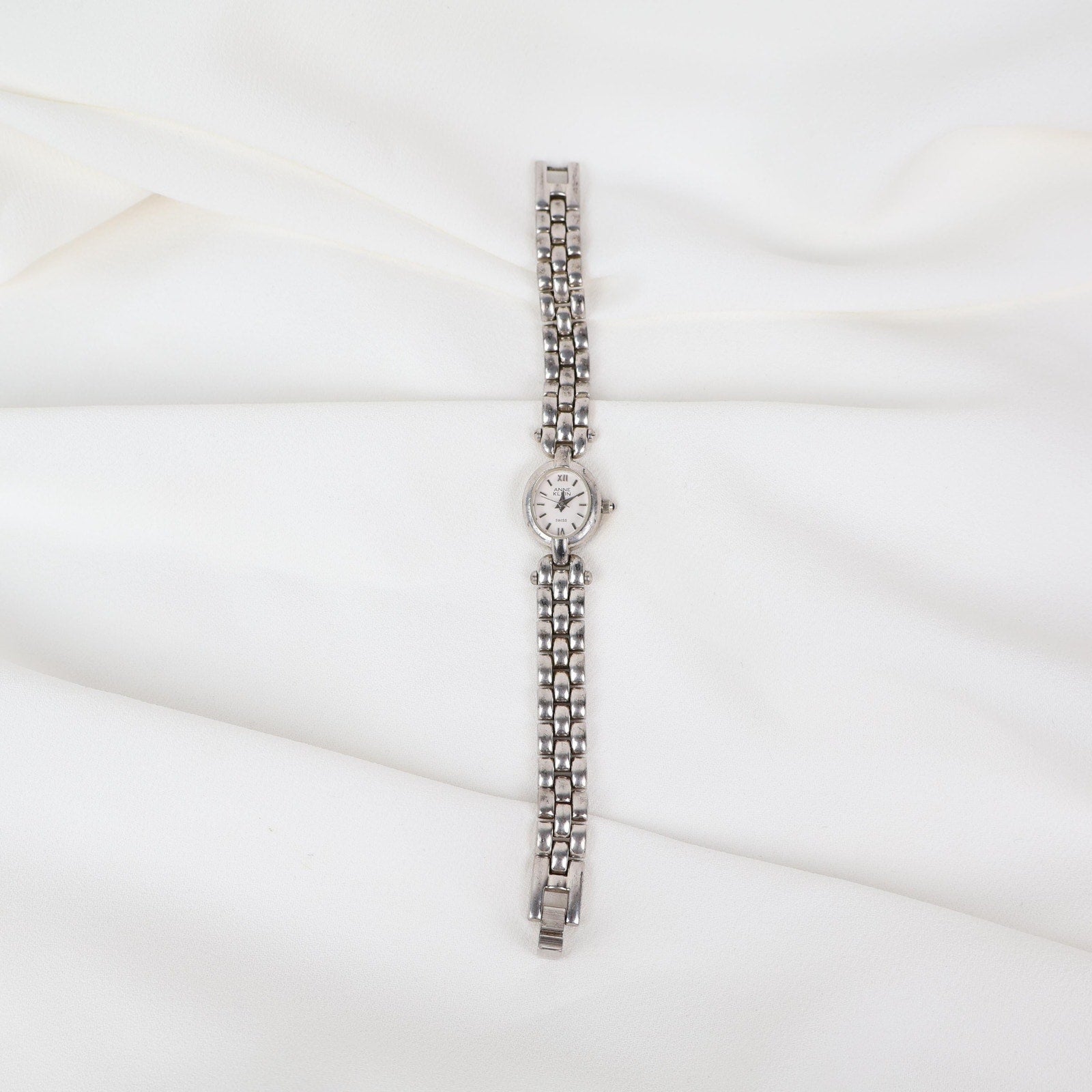 Vintage Silver Anne Klein Watch with an Oval Shaped Face