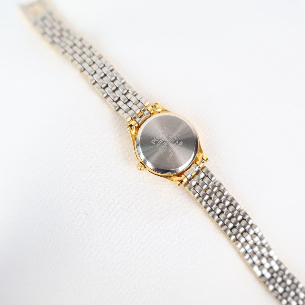 Vintage Gold Tone Pulsar Watch with a Circle Face