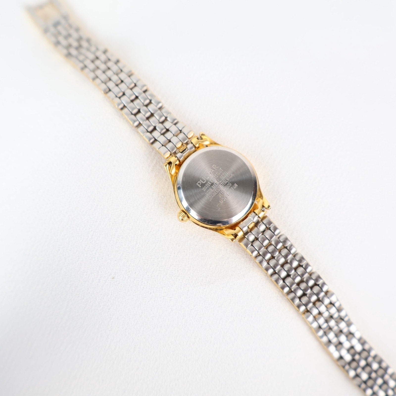 Vintage Gold Tone Pulsar Watch with a Circle Face