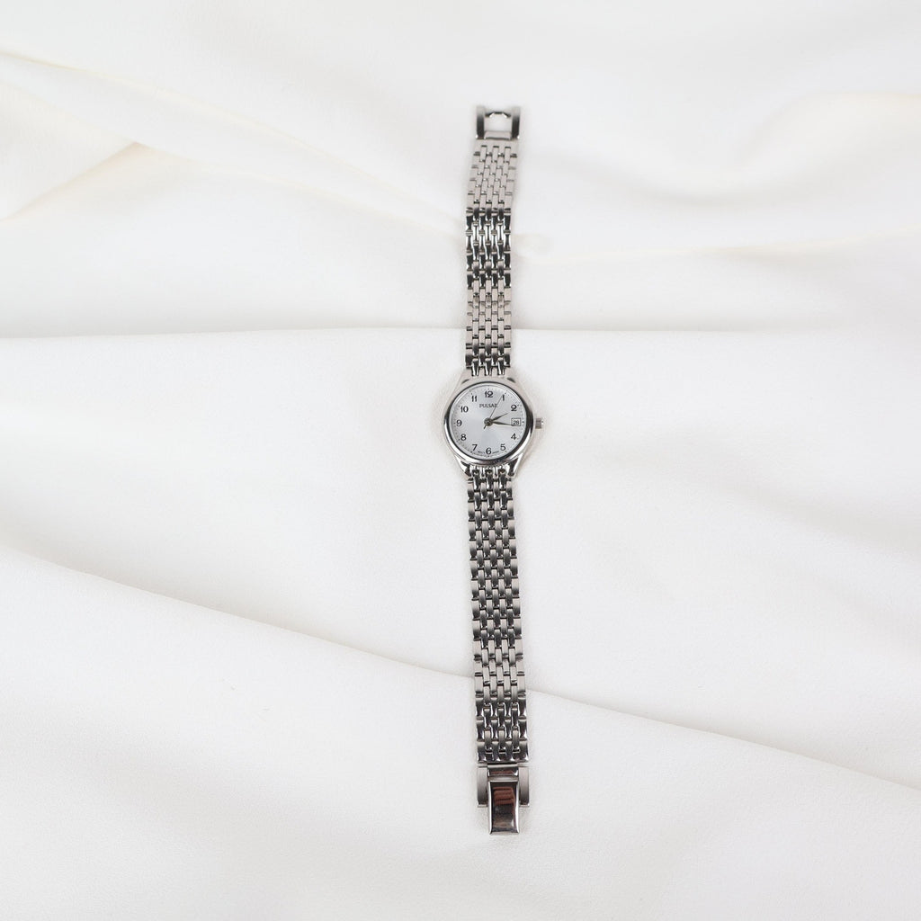 Vintage Silver Pulsar Watch with a Round Face