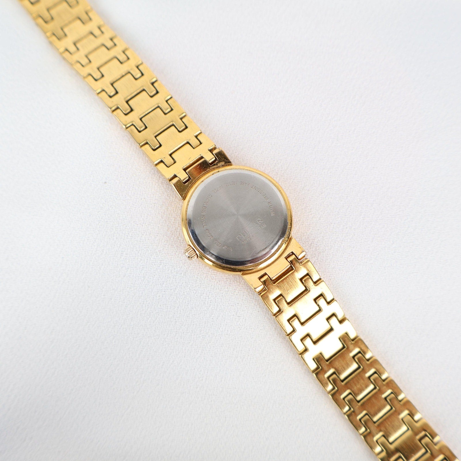Vintage Gold Tone Pulsar Watch with a Circle Face