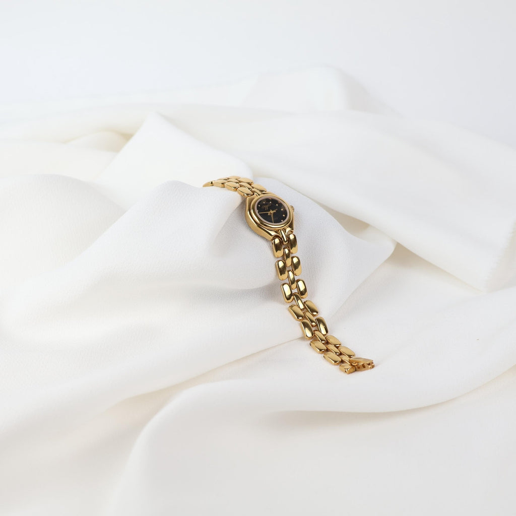 Vintage Black and Gold Worthington Watch with Round Face