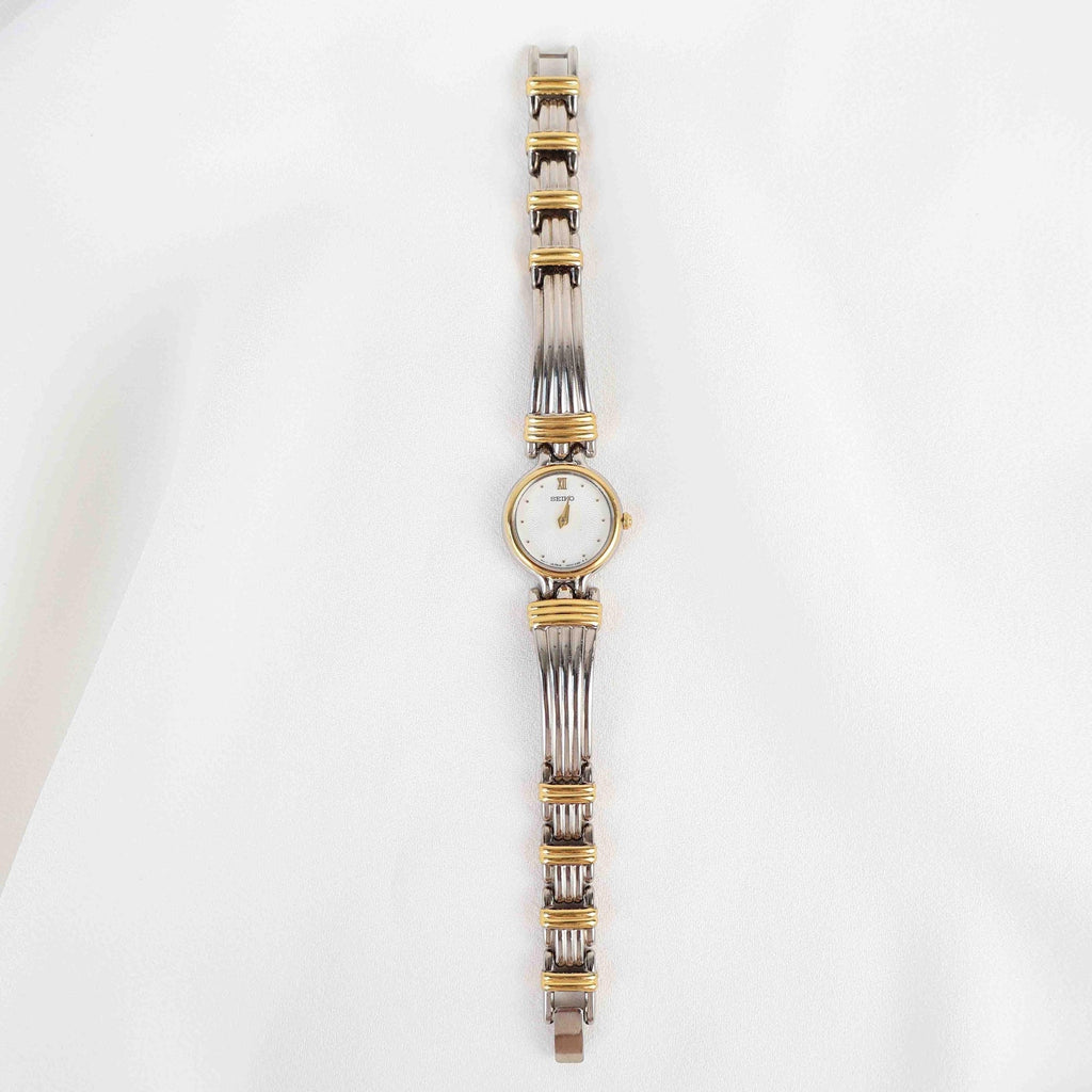 Vintage Two Tone Seiko with a White Round Face - (Working Battery)