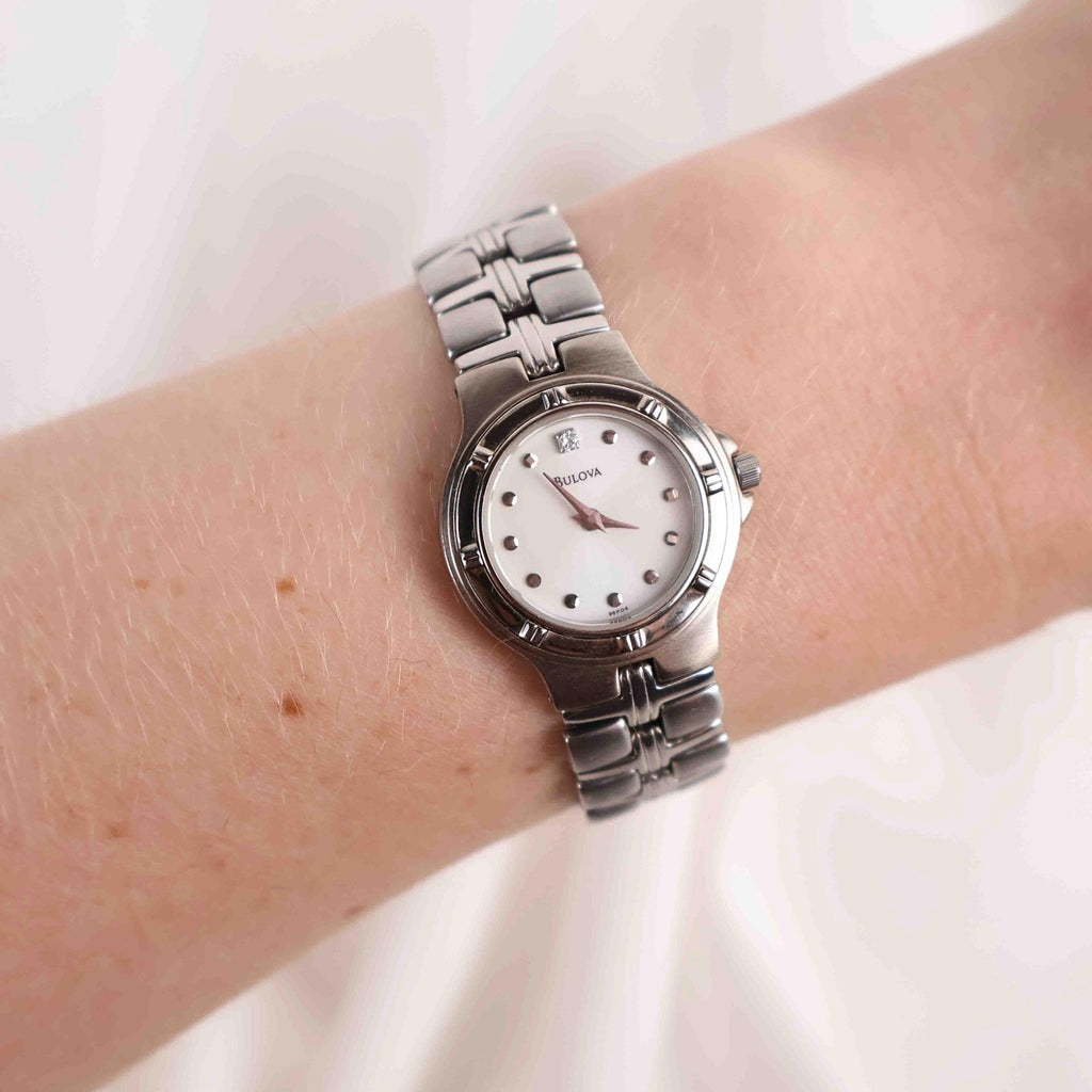 Vintage Silver Tone Bulova Watch with Round White Watch Face