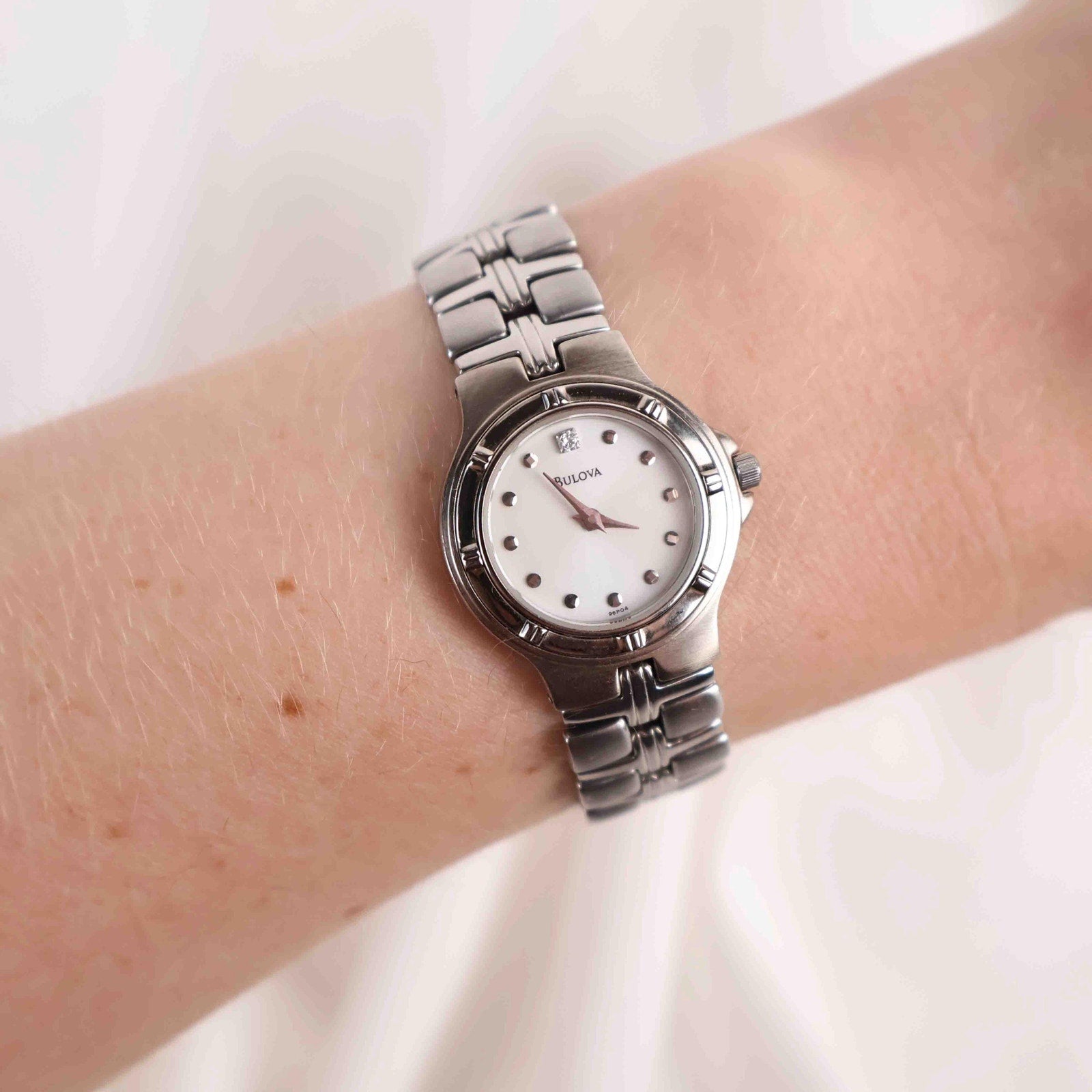 Vintage Silver Tone Bulova Watch with Round White Watch Face