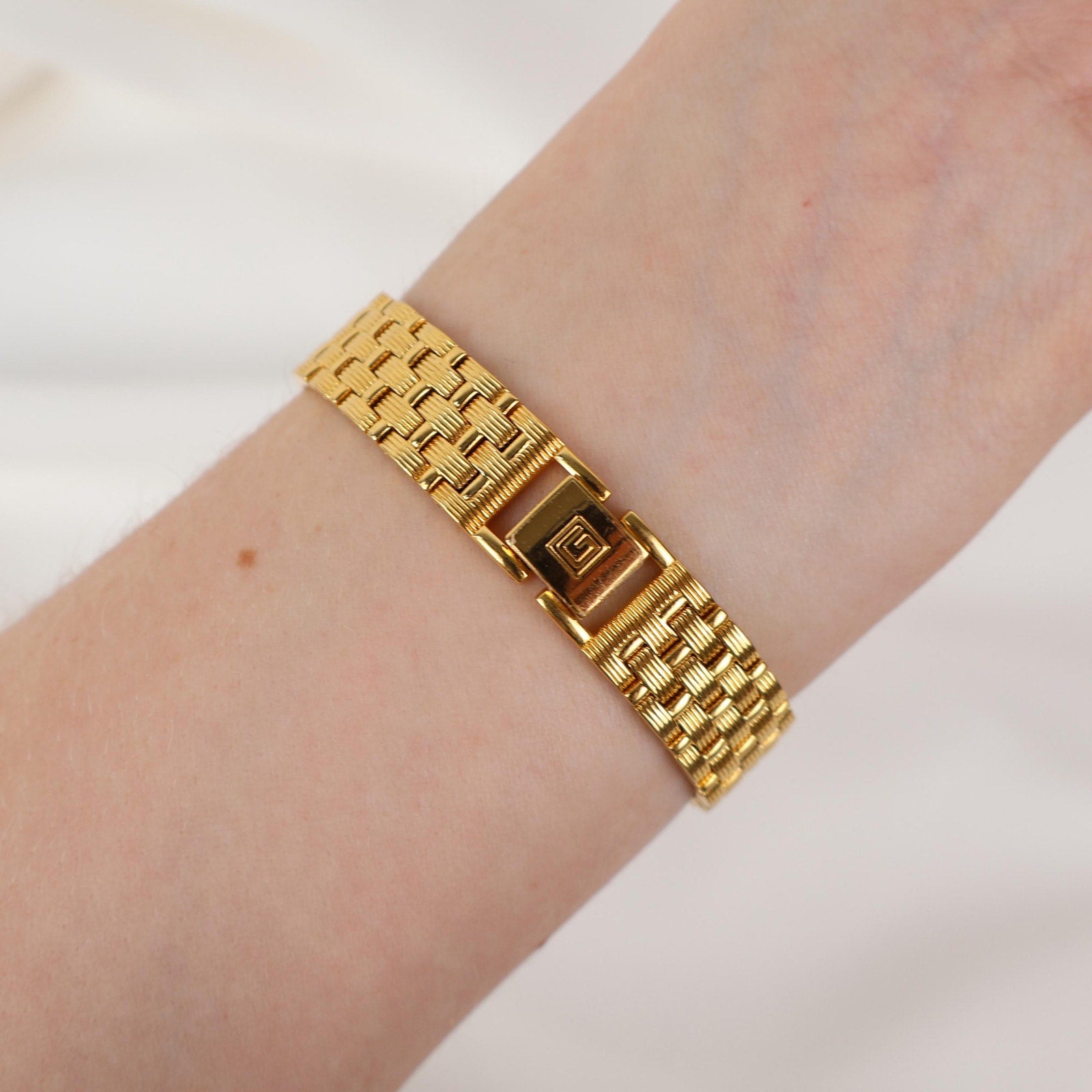 Vintage Gold Christian Gold Watch with a Rectangle Face