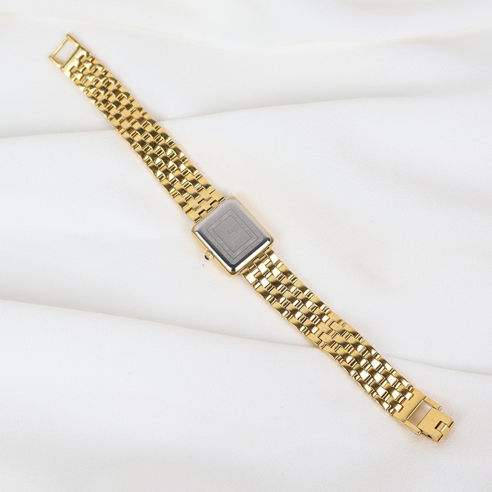 Vintage Gold Christian Gold Watch with a Rectangle Face