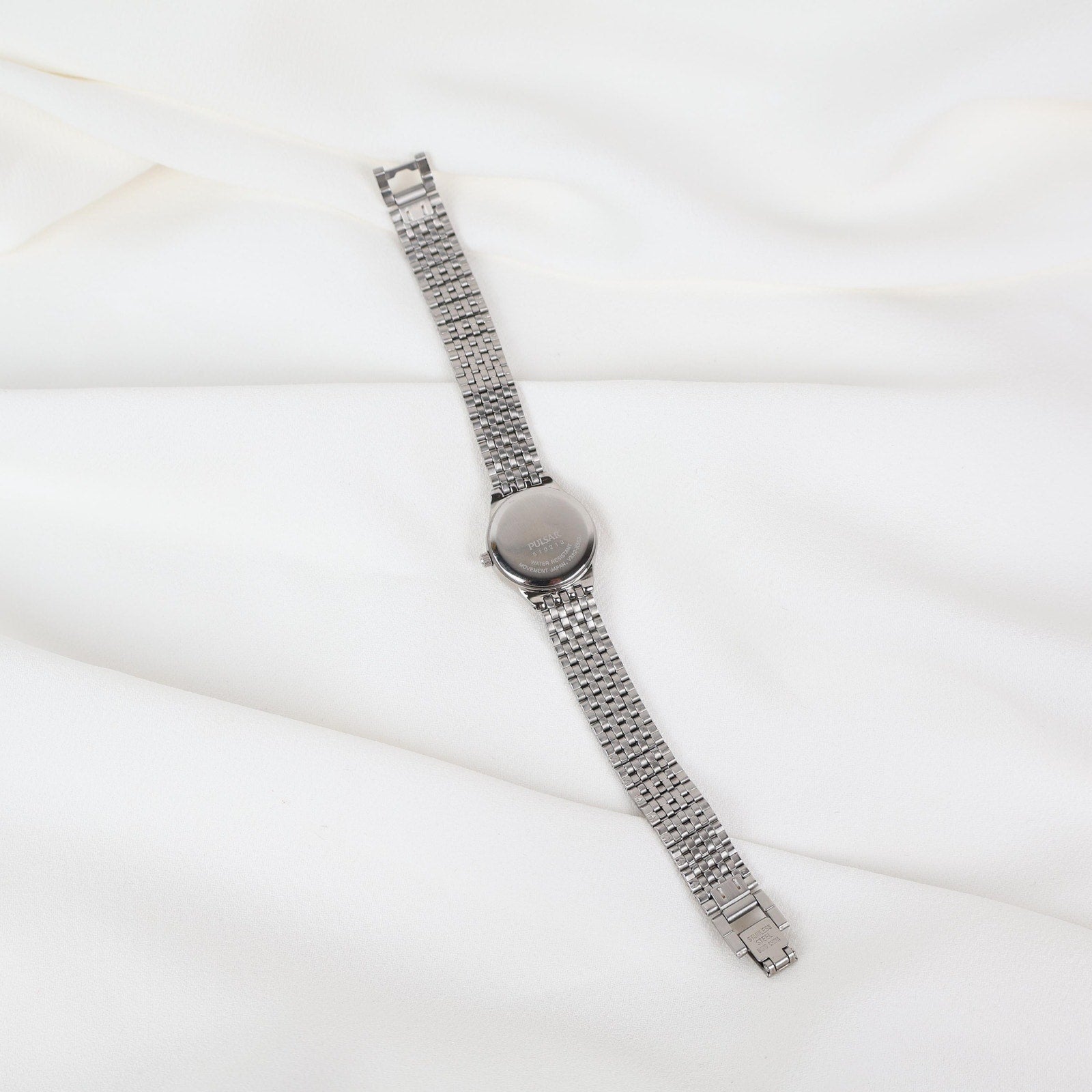 Vintage Silver Pulsar Watch with a Round Face