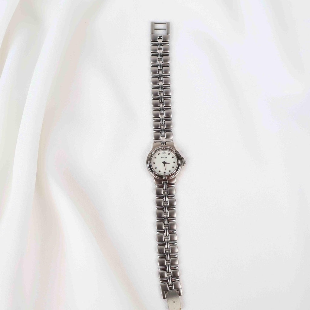 Vintage Silver Tone Bulova Watch with Round White Watch Face