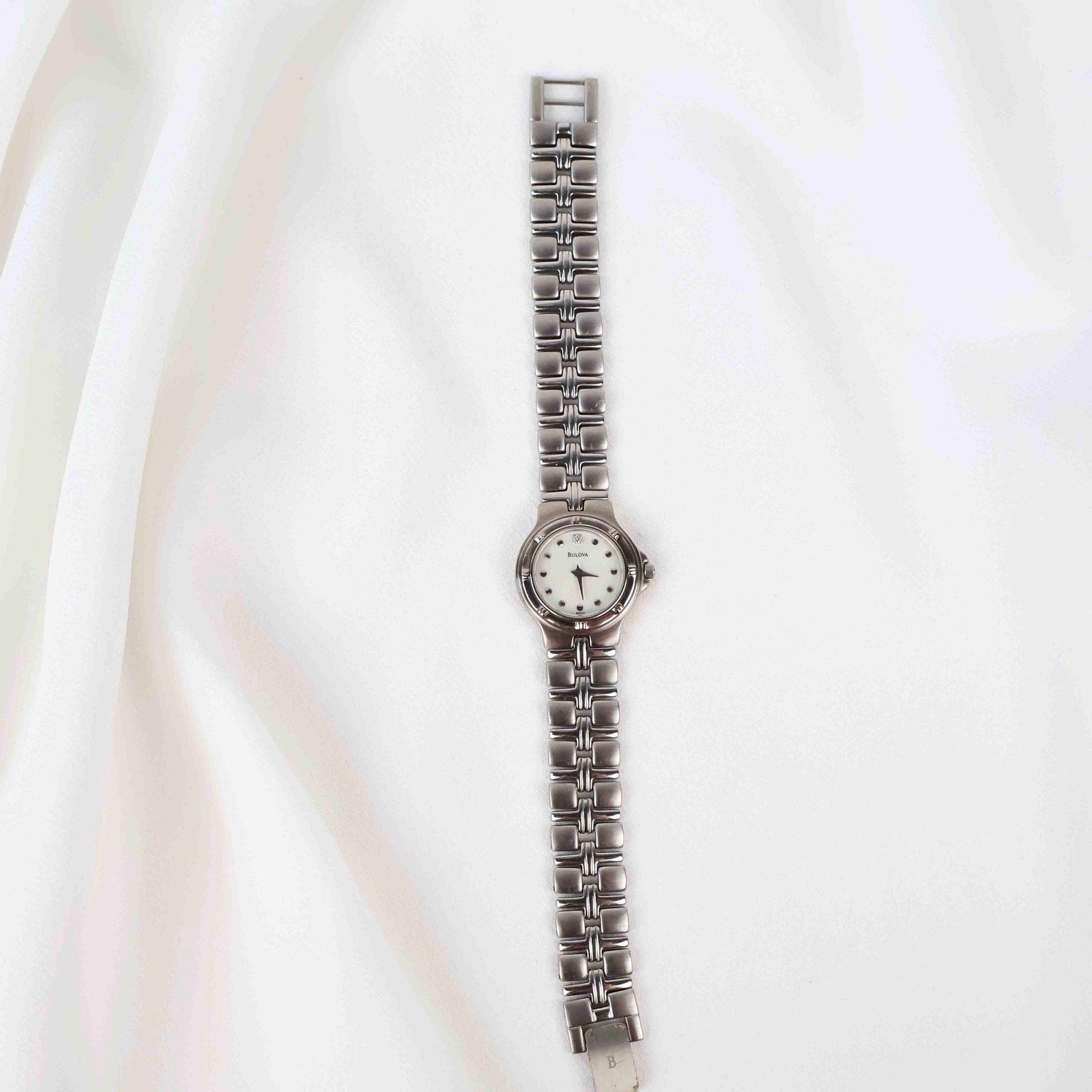 Vintage Silver Tone Bulova Watch with Round White Watch Face