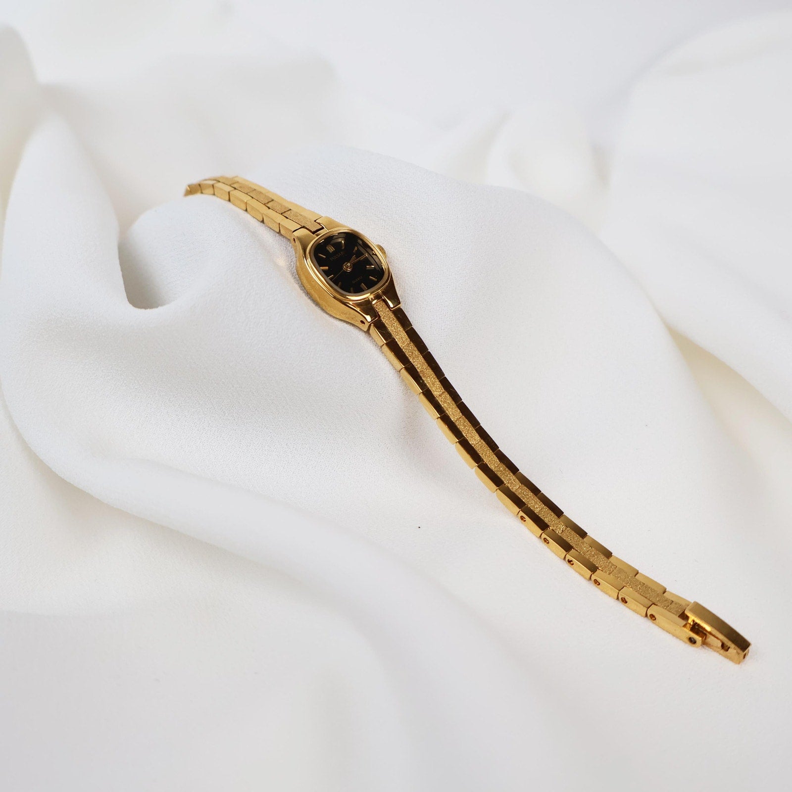 Vintage Black and Gold Pulsar Watch