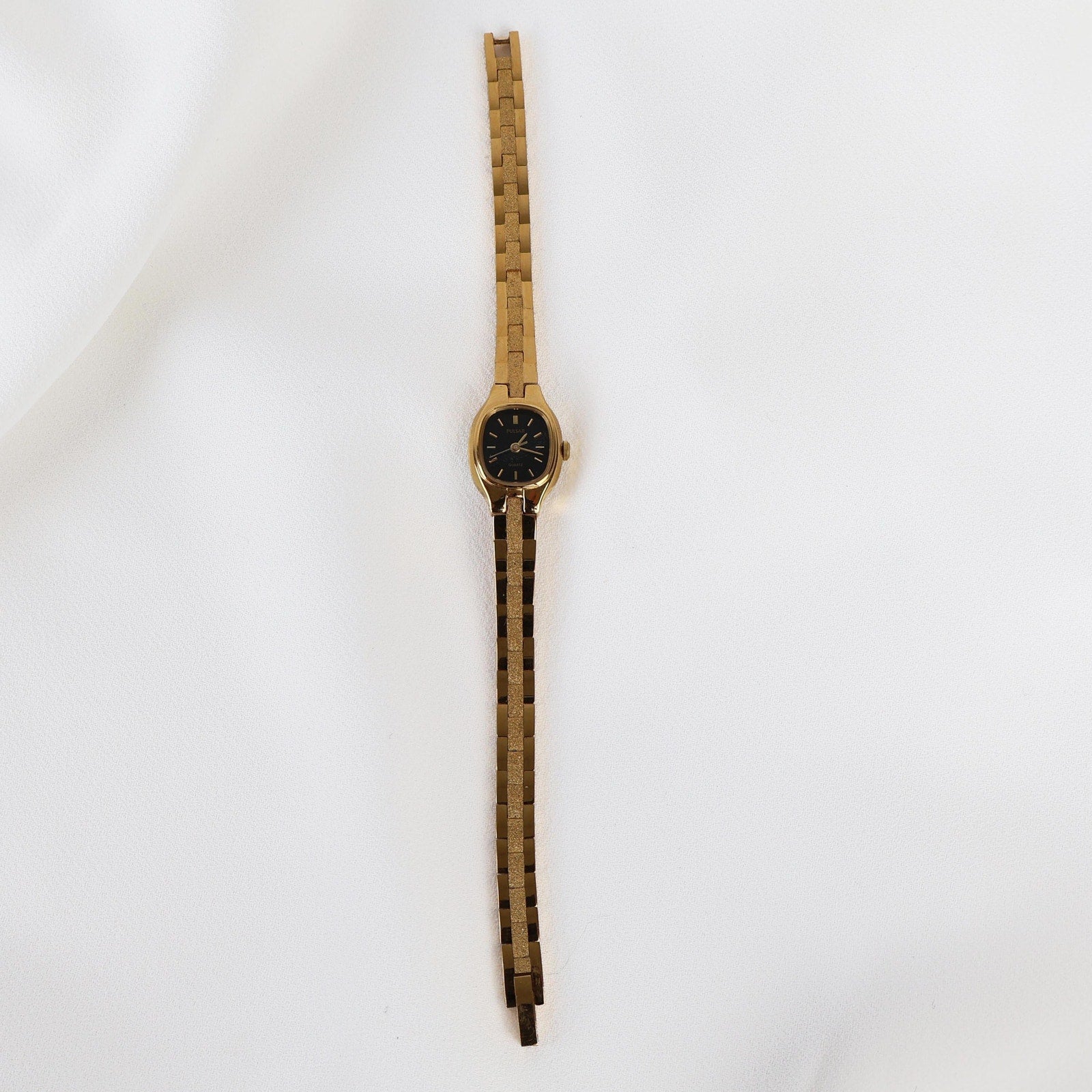 Vintage Black and Gold Pulsar Watch