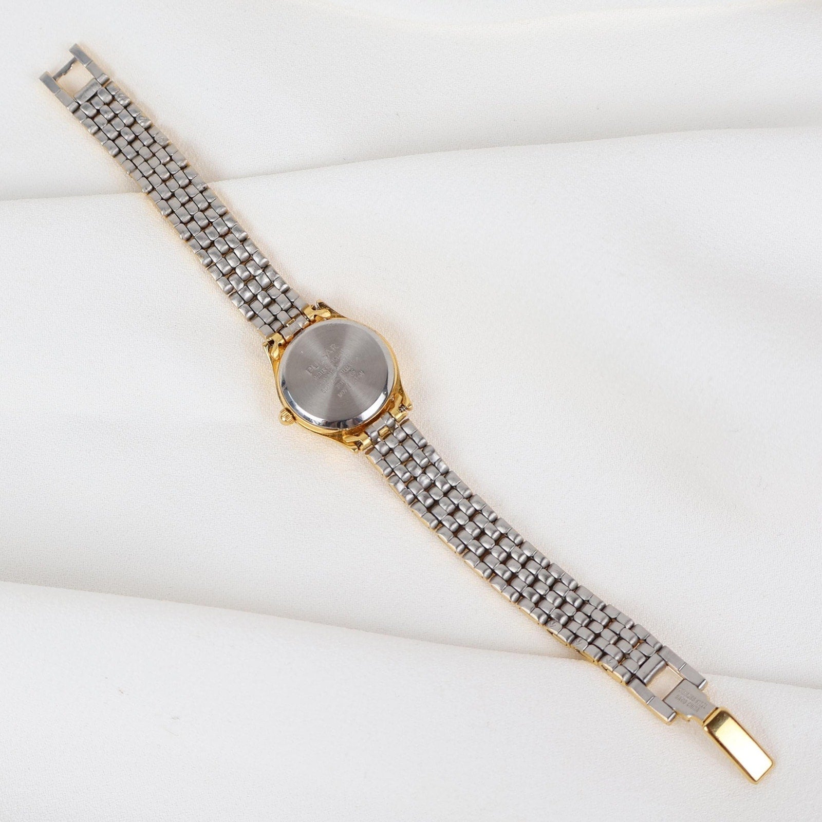 Vintage Gold Tone Pulsar Watch with a Circle Face