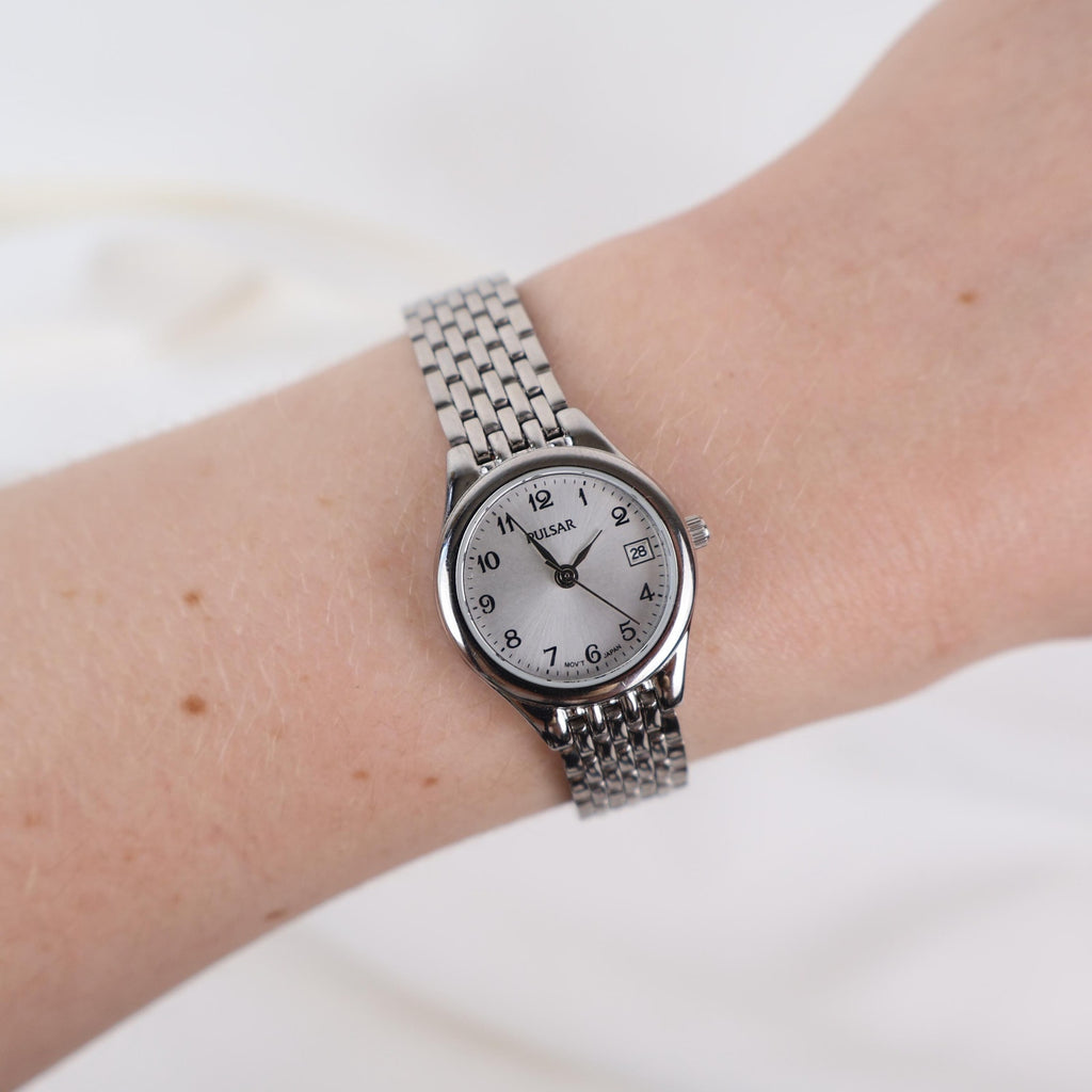 Vintage Silver Pulsar Watch with a Round Face