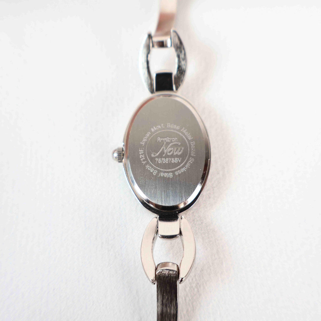 Vintage Silver Armitron Watch with Pink Oval Face, Japanese Movement