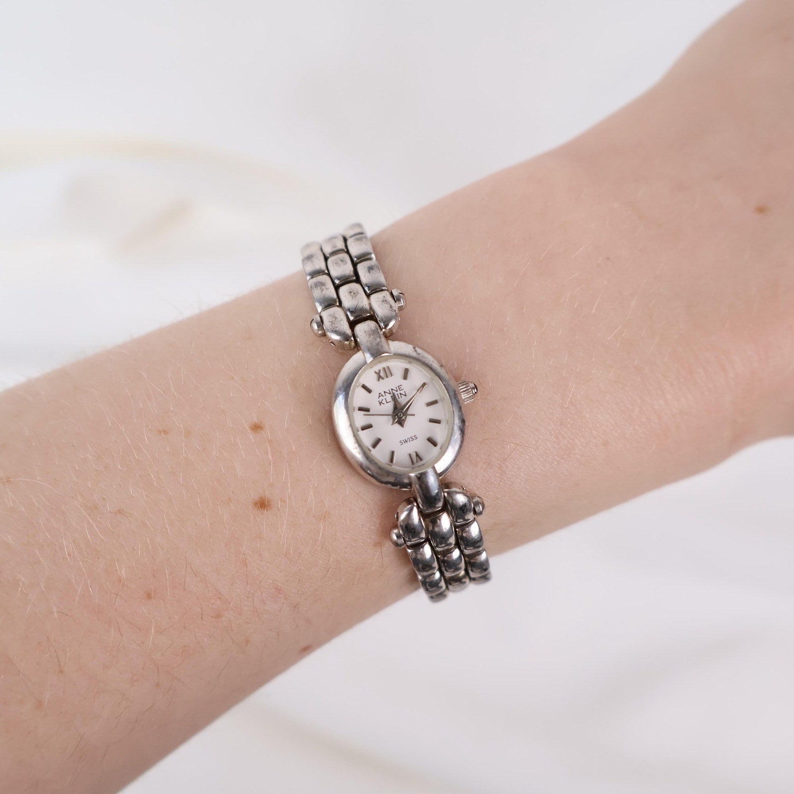 Vintage Silver Anne Klein Watch with an Oval Shaped Face