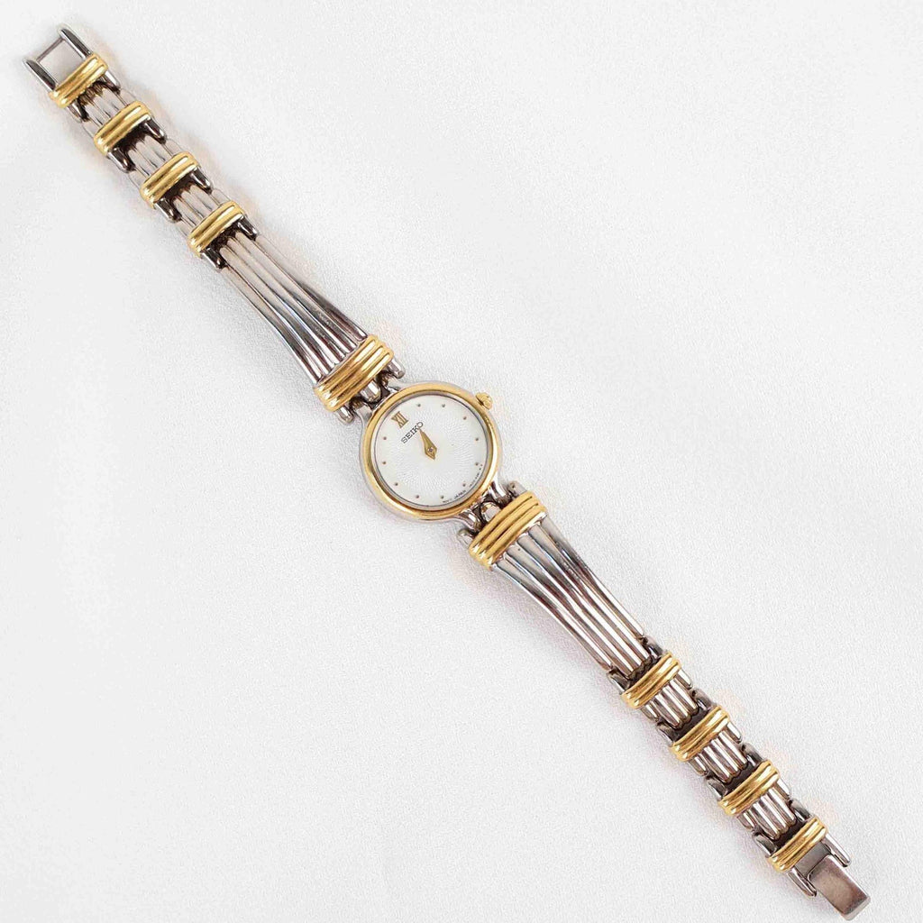 Vintage Two Tone Seiko with a White Round Face - (Working Battery)