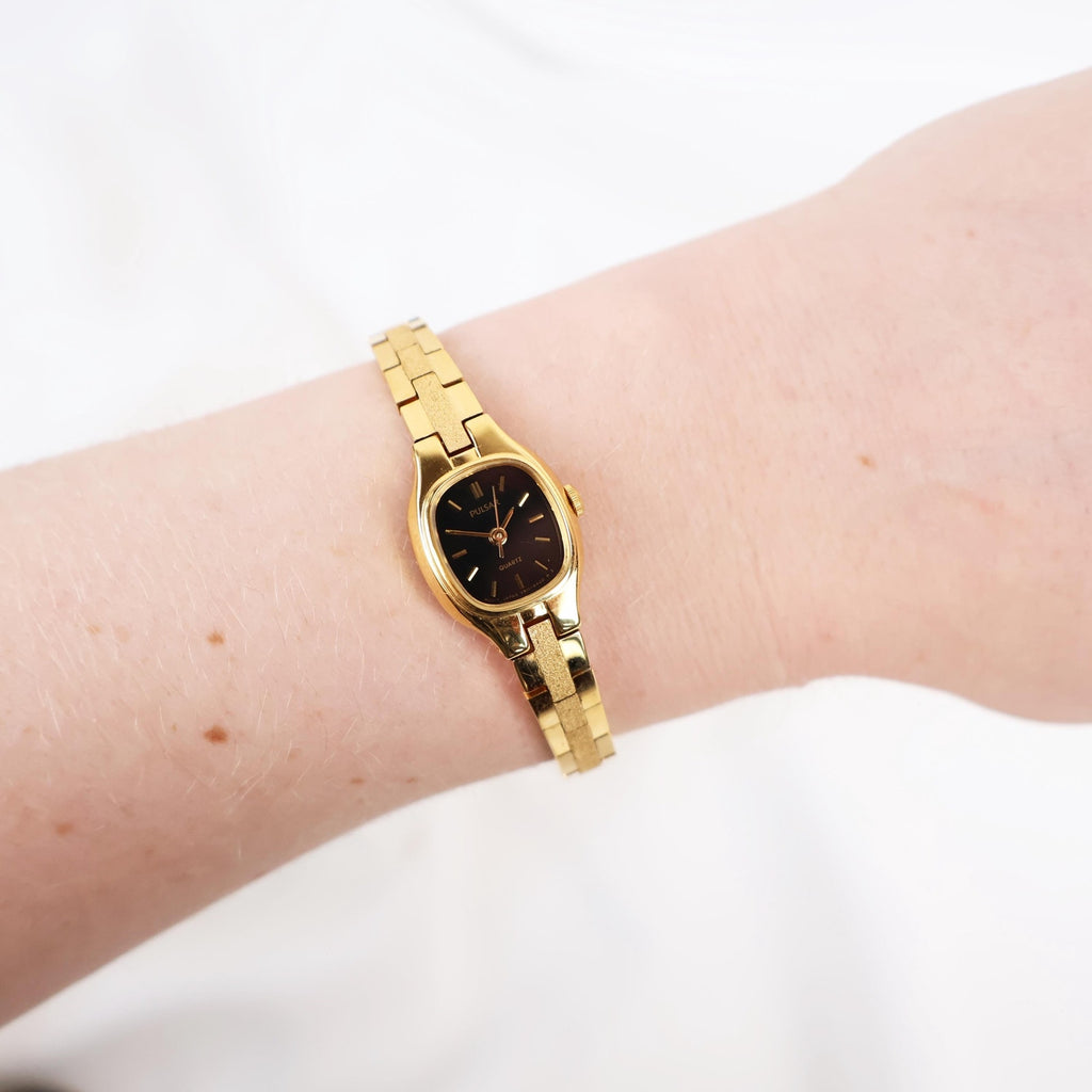 Vintage Black and Gold Pulsar Watch