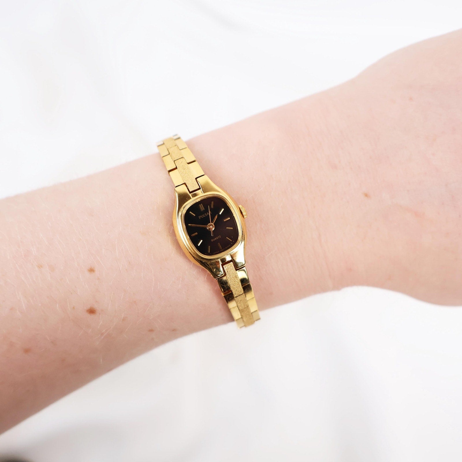 Vintage Black and Gold Pulsar Watch