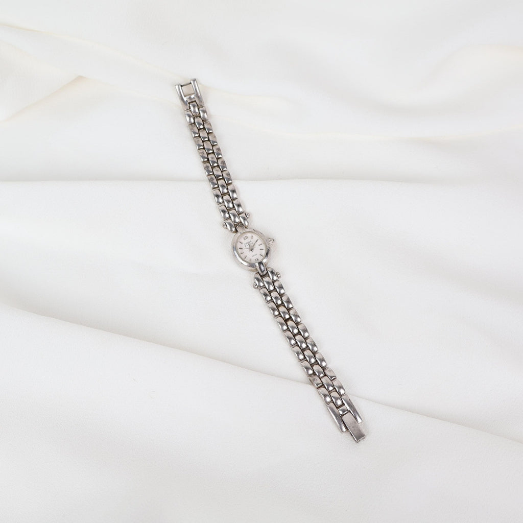 Vintage Silver Anne Klein Watch with an Oval Shaped Face
