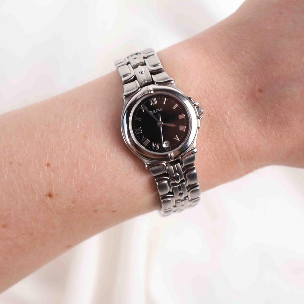 Vintage Silver Tone Bulova Watch with Round Black Watch Face