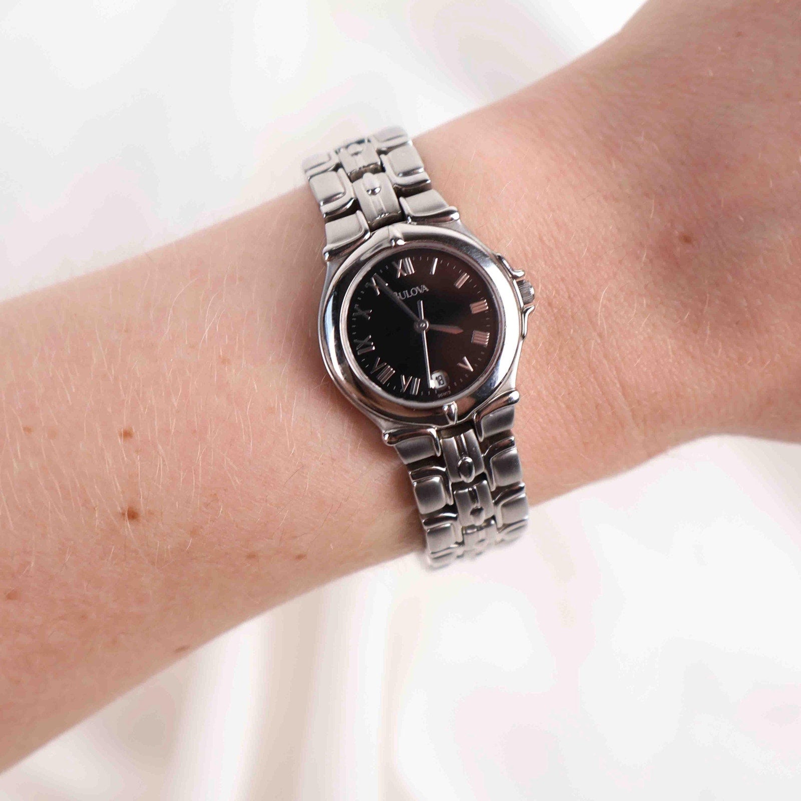 Vintage Silver Tone Bulova Watch with Round Black Watch Face