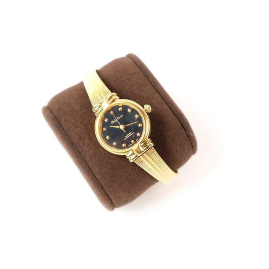 Vintage Gold Watch with Black Round Face | Philip Persio