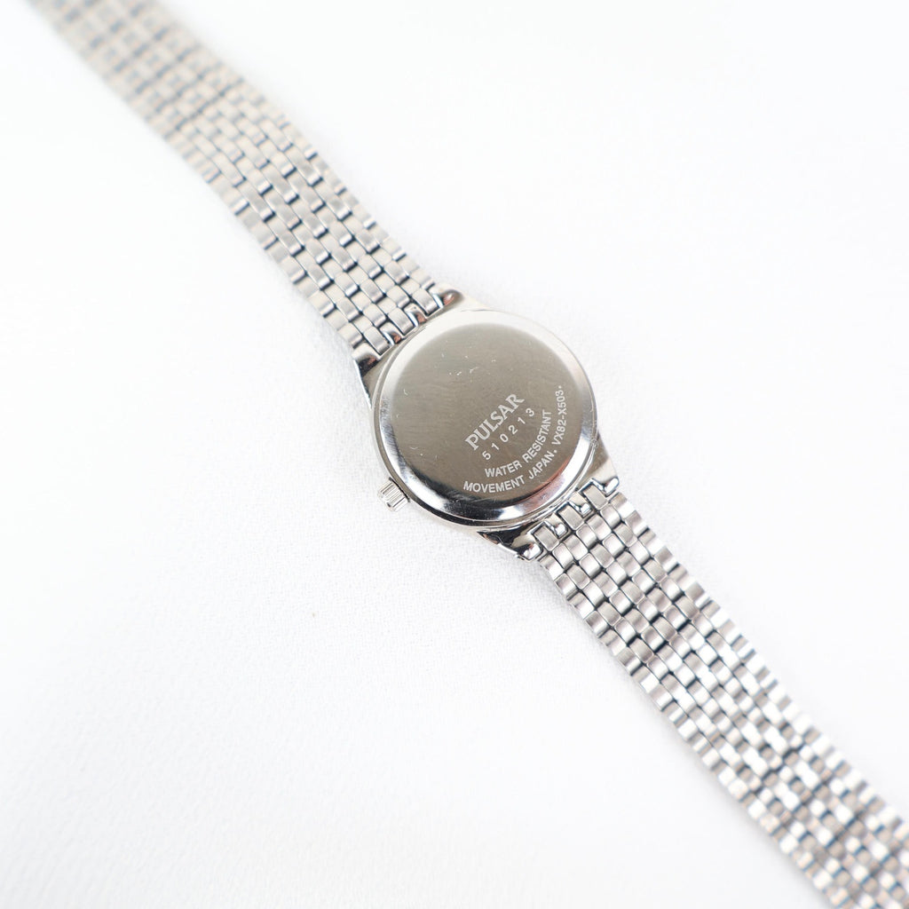 Vintage Silver Pulsar Watch with a Round Face