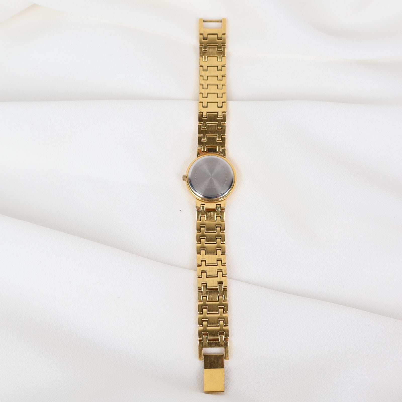 Vintage Gold Tone Pulsar Watch with a Circle Face