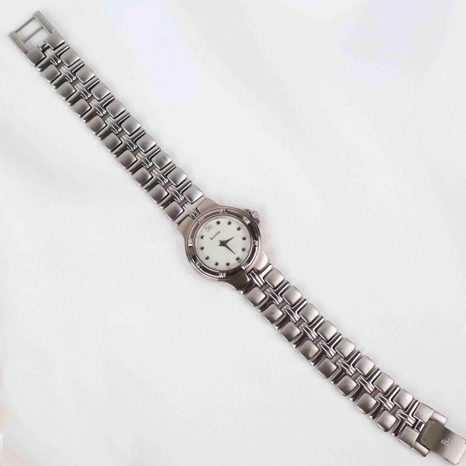 Vintage Silver Tone Bulova Watch with Round White Watch Face