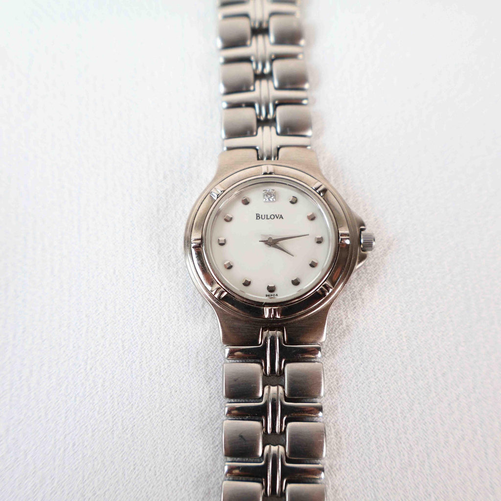 Vintage Silver Tone Bulova Watch with Round White Watch Face