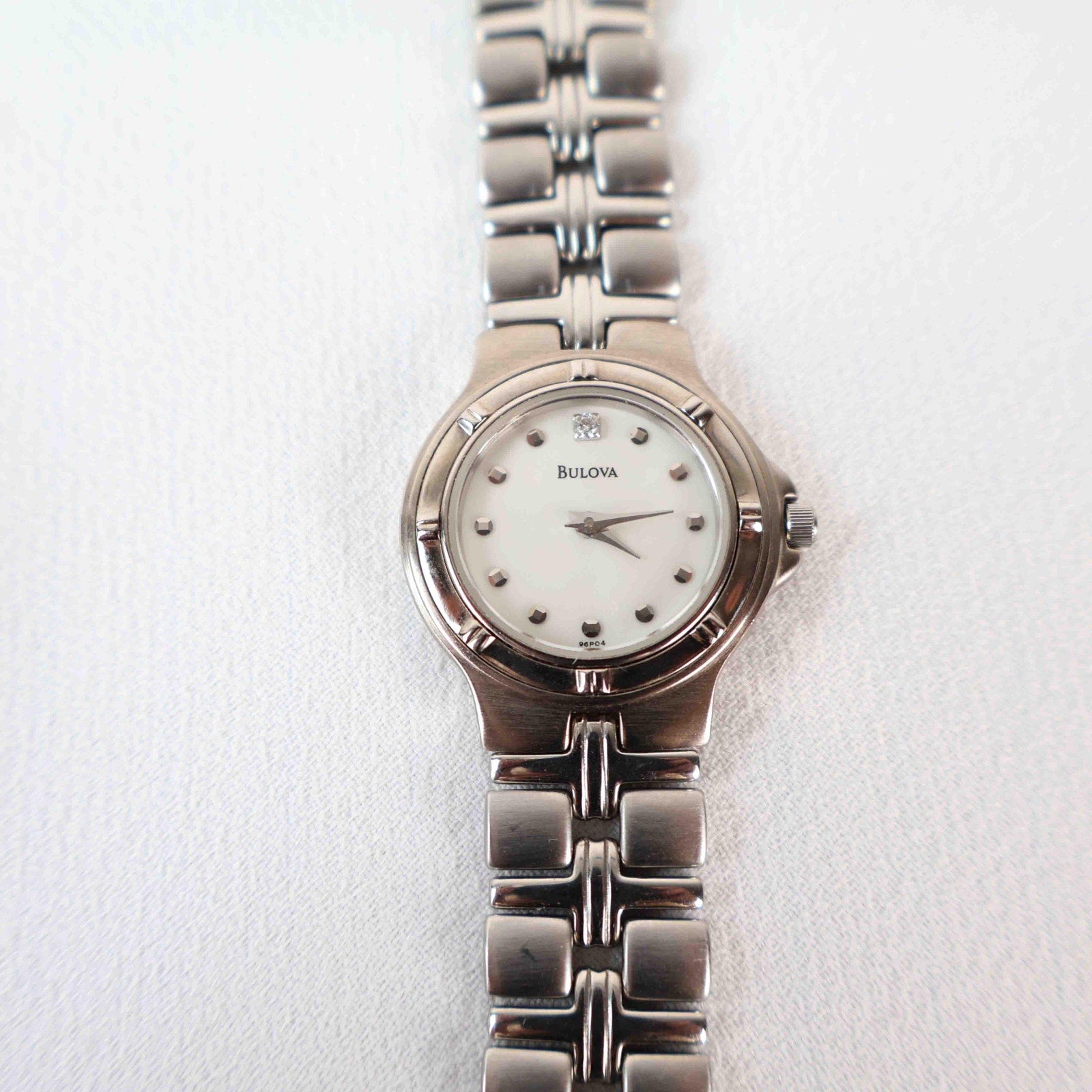 Vintage Silver Tone Bulova Watch with Round White Watch Face
