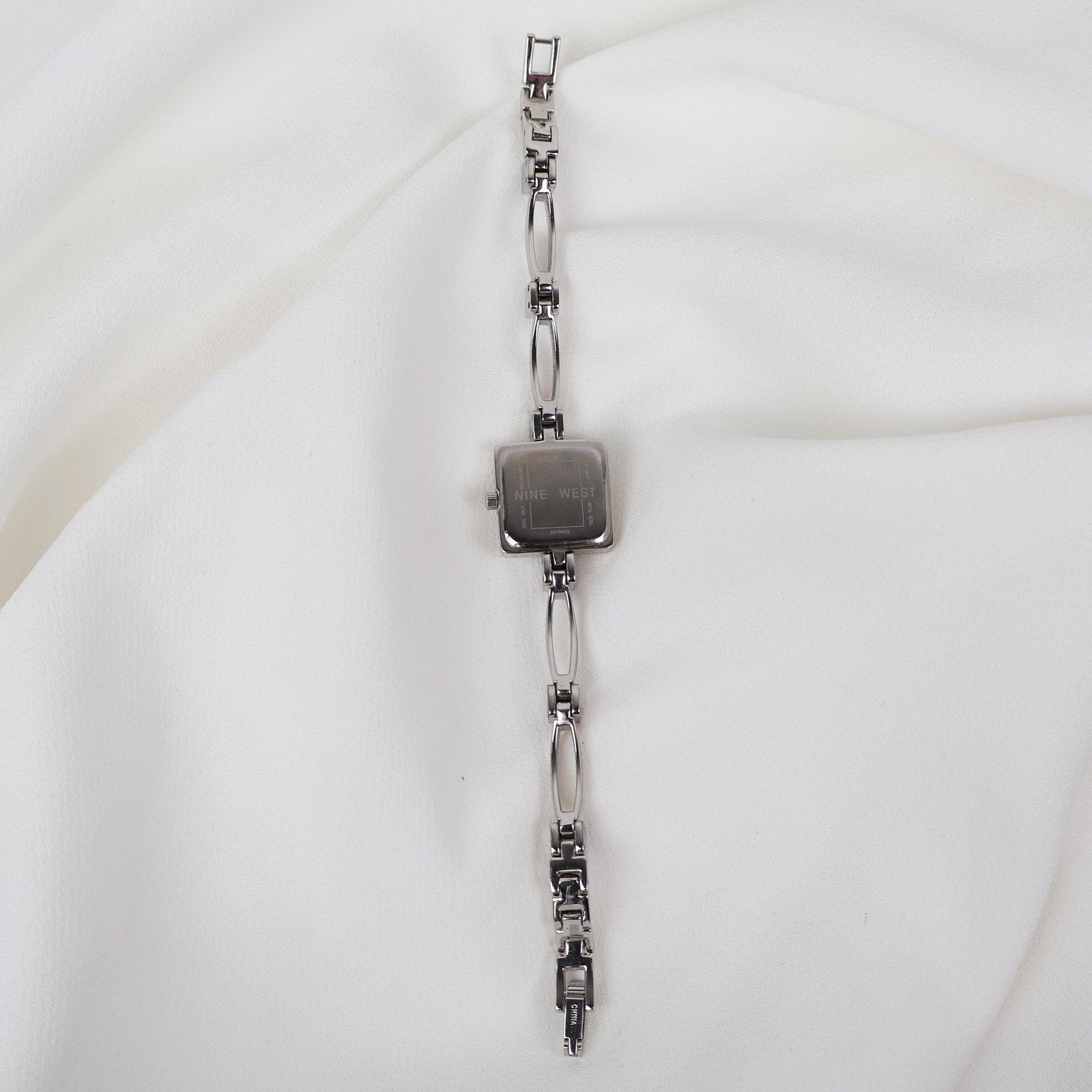 Vintage Silver Nine West Bracelet Watch with Blue Gem Embellishments