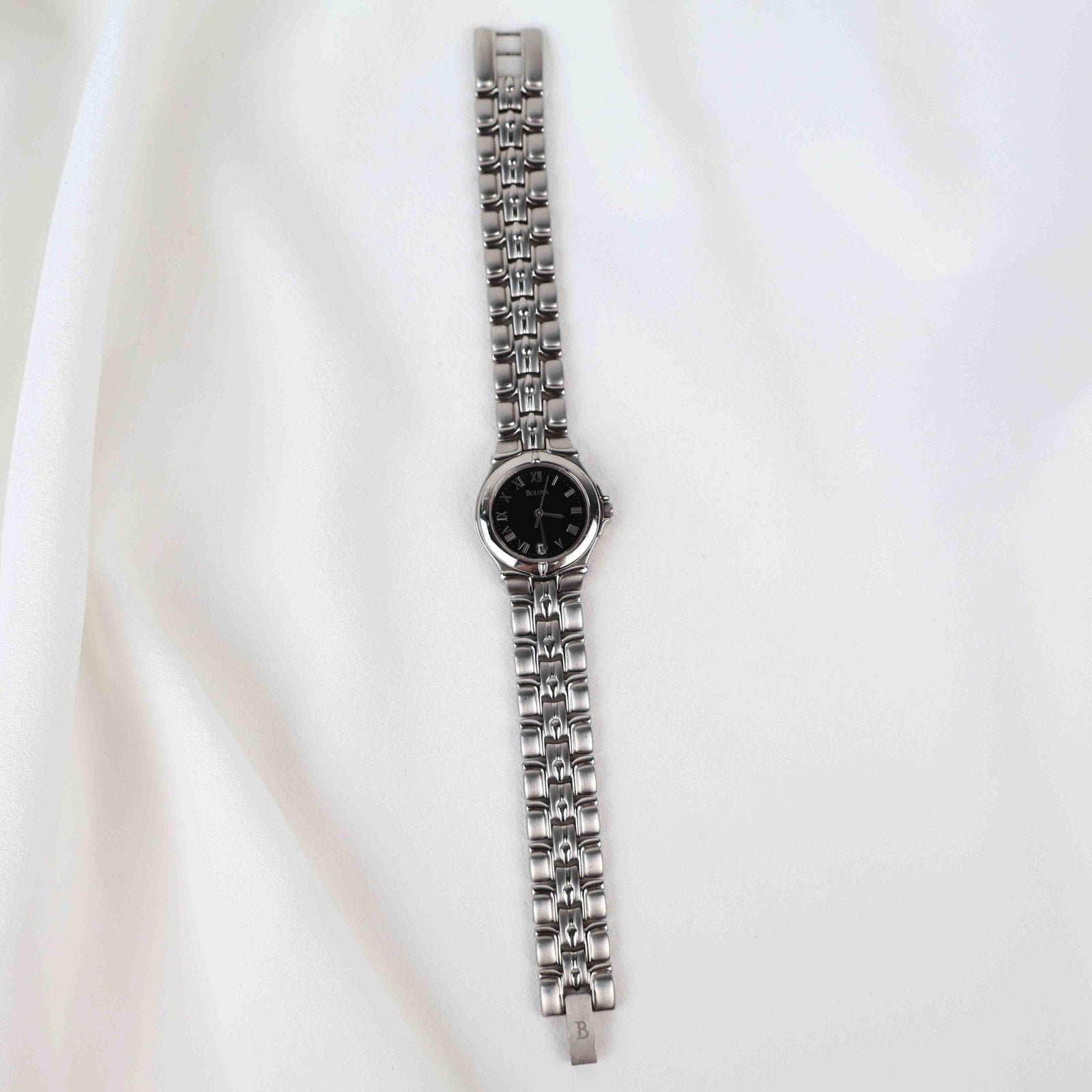 Vintage Silver Tone Bulova Watch with Round Black Watch Face