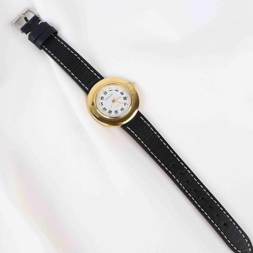 Vintage Embassy Watch with a Gold Round Face and Black Leather Strap
