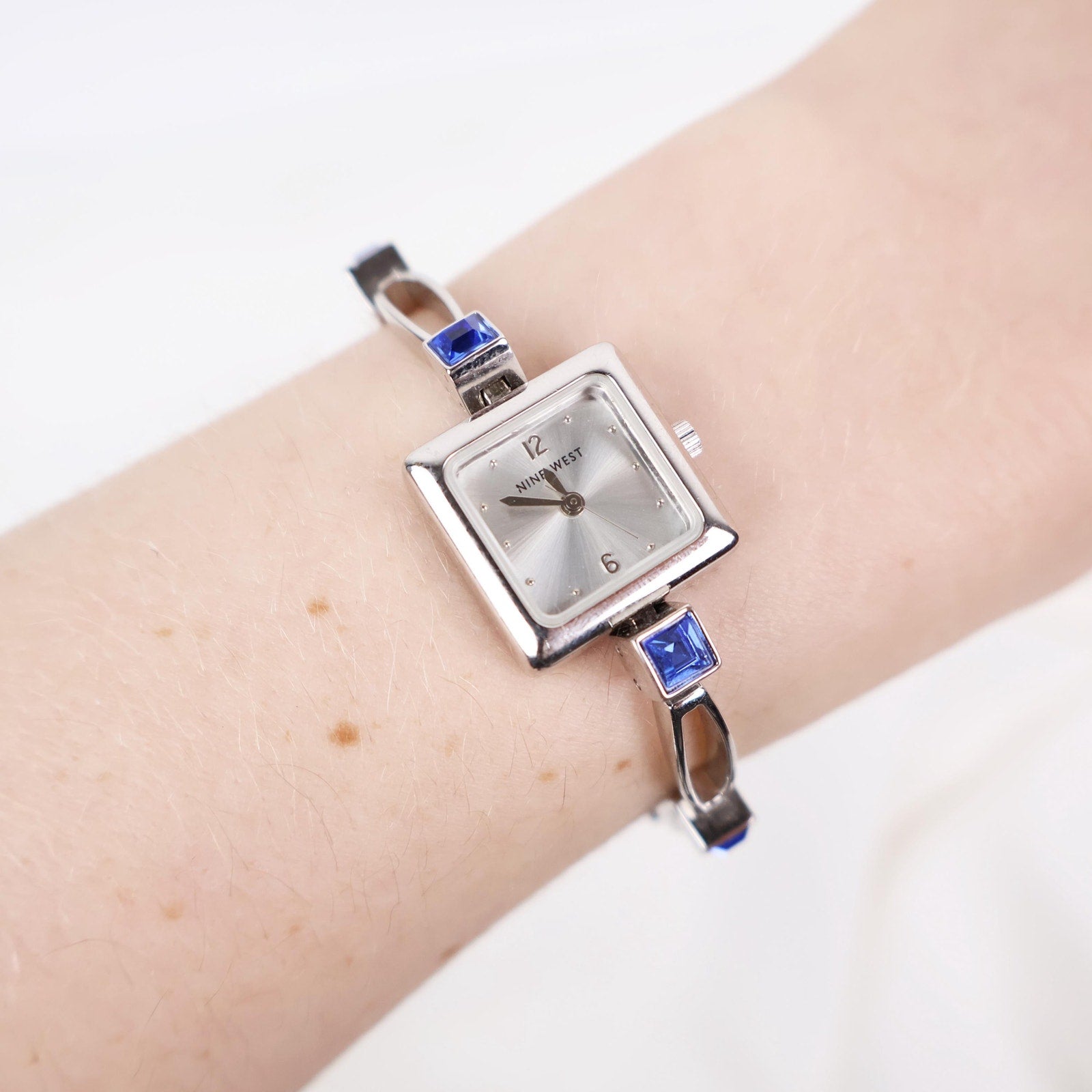 Vintage Silver Nine West Bracelet Watch with Blue Gem Embellishments