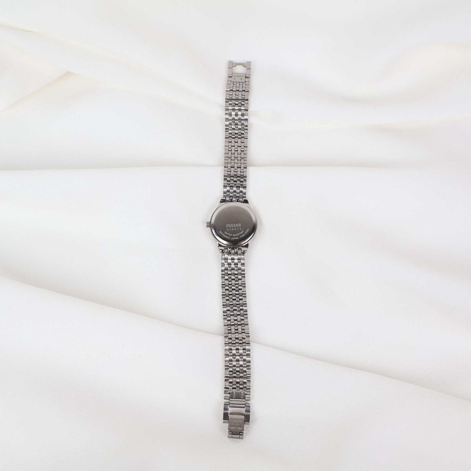 Vintage Silver Pulsar Watch with a Round Face